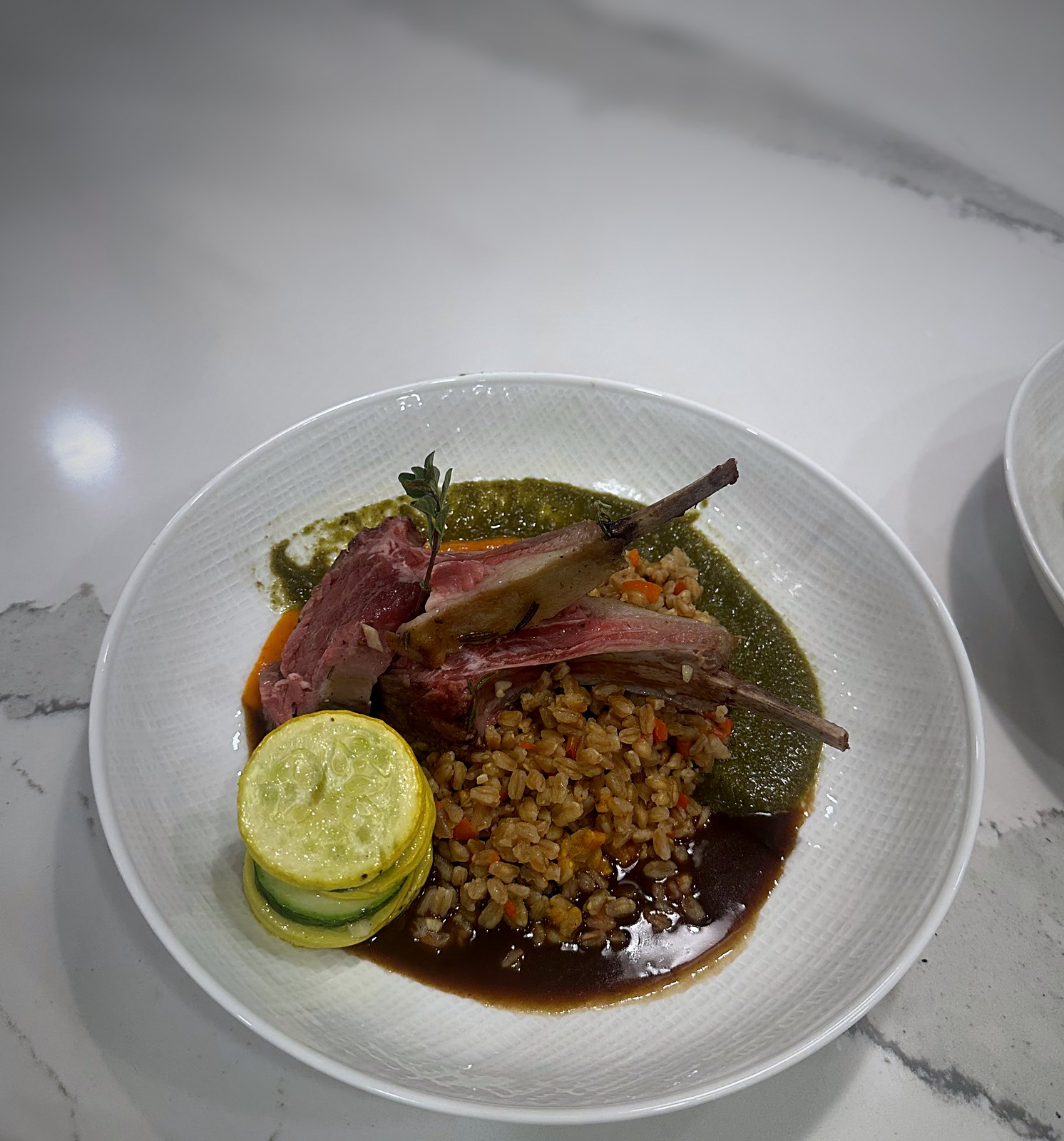 Lamb chops with farro and a zucchini rosette